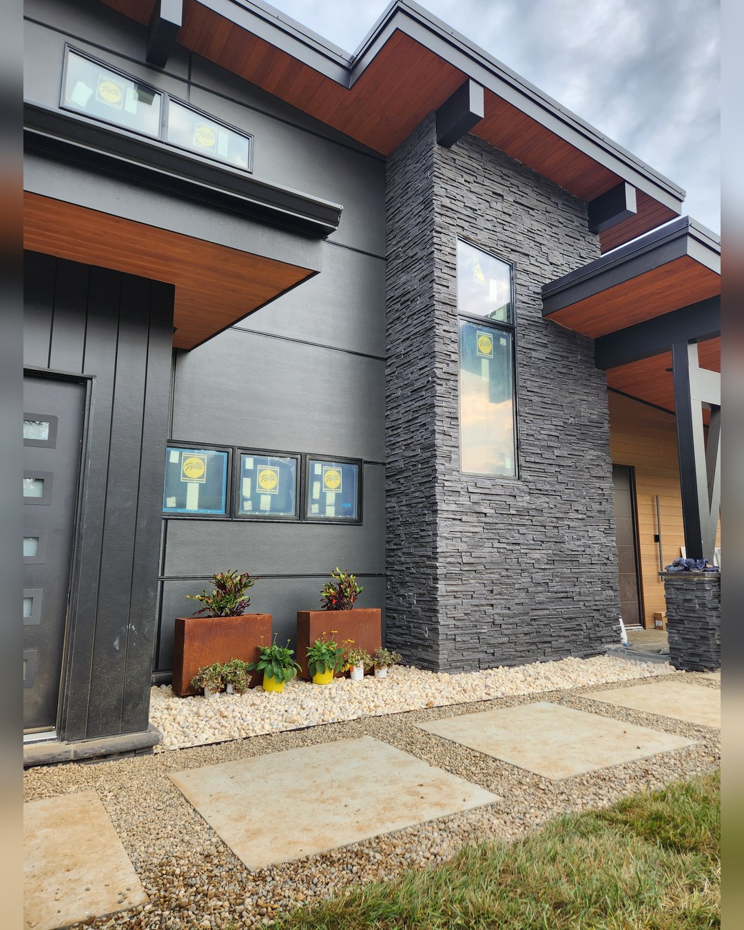 Exterior detail where stone, wood and metal meet