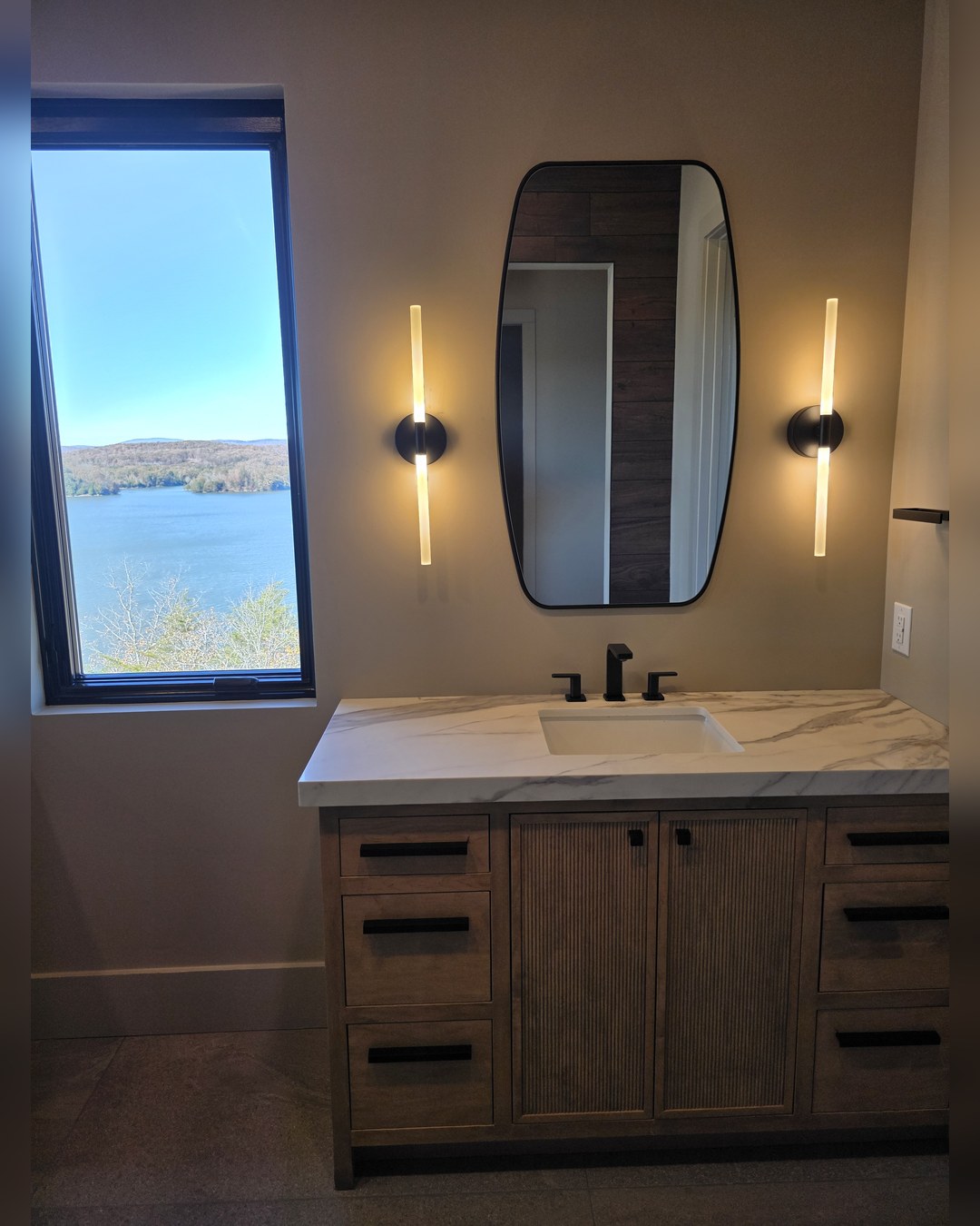 Bathroom vanity with a lake view