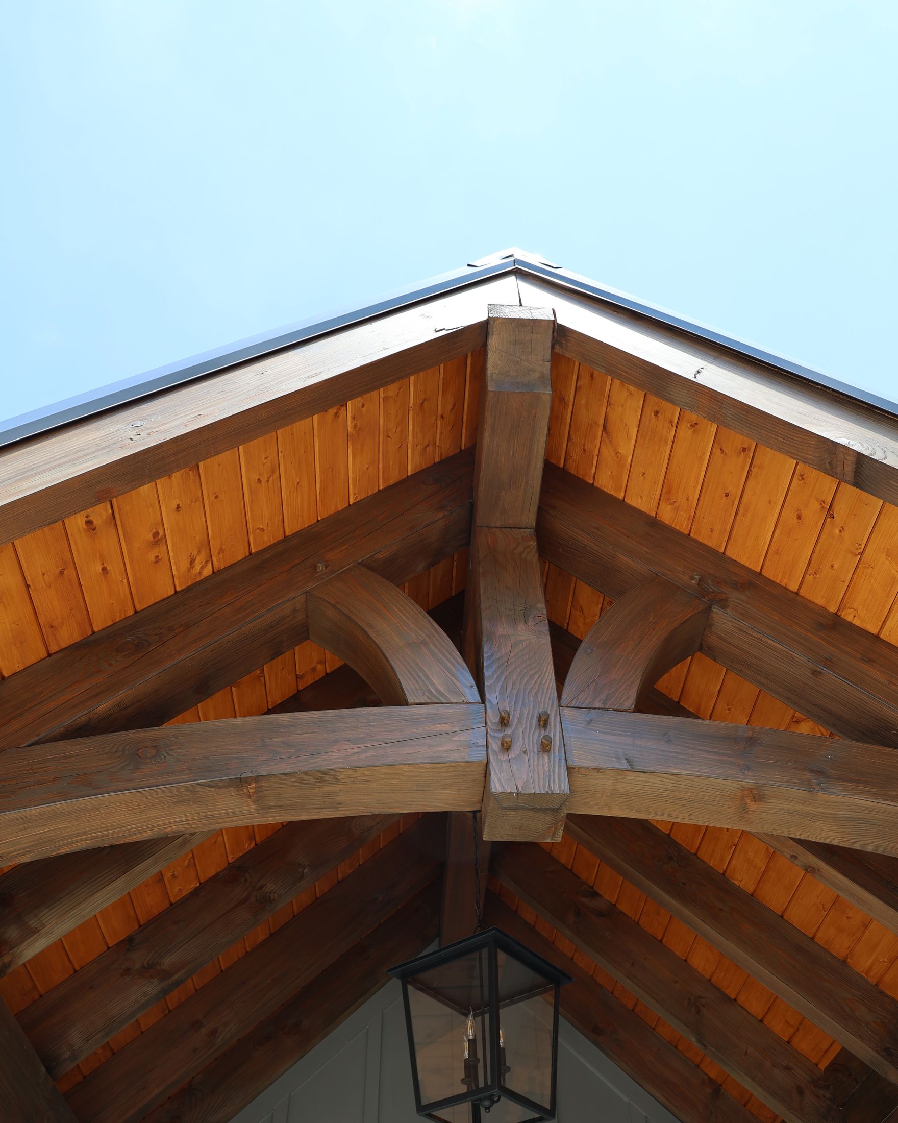 Heavy timber trusses and a stained ceiling