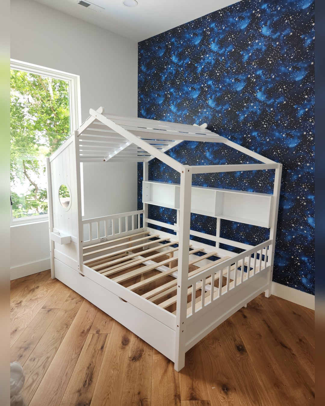 Child's bedroom built around a house-frame bed